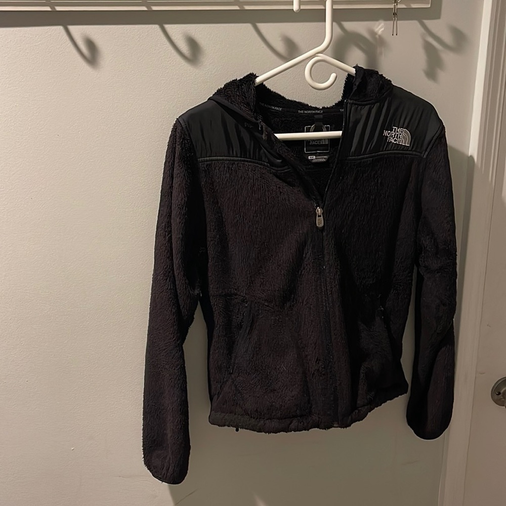 Black fuzzy north face jacket